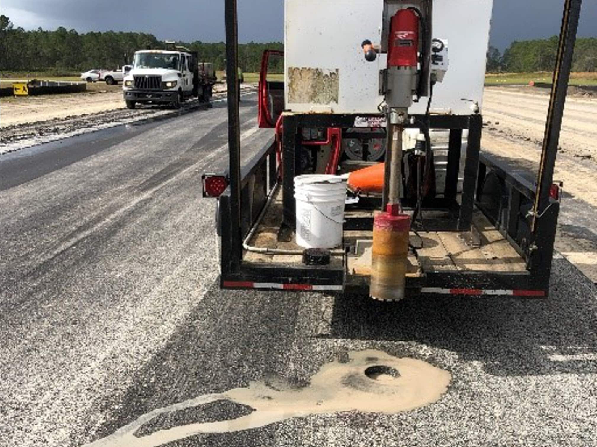 Resident Project Representative Collecting an Asphalt Core Sample